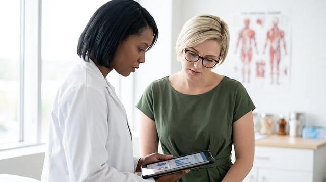 Best dermatologist for acne: A female doctor in a lab coat showing a tablet to a patient
