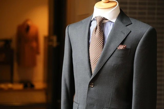 Tailored men's suit jacket and tie on a mannequin