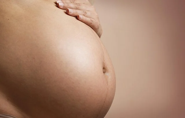 A close-up of a pregnant woman's belly