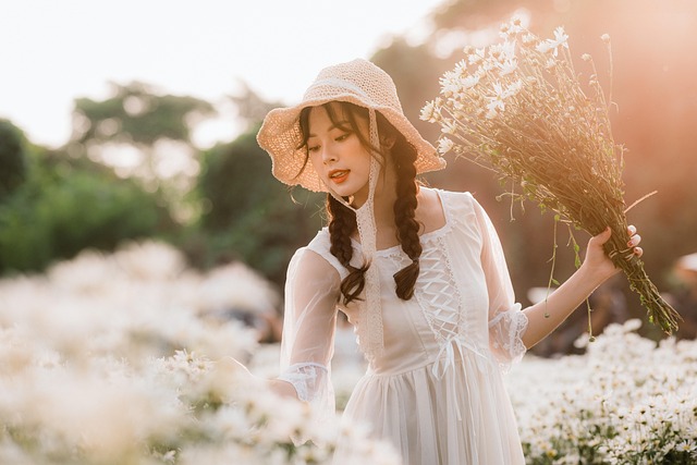 Woman belting a flowy DÔEN dress to define her waist