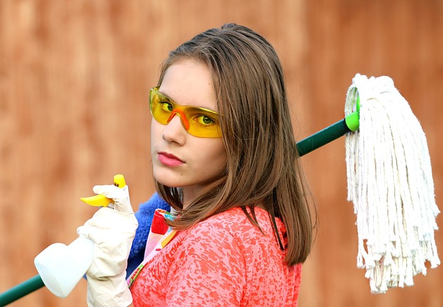 A woman carefully cleaning a luxury leather handbag with a soft cloth