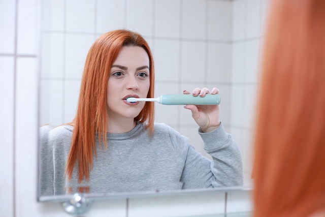 Woman gently brushing her hair with a wide-tooth comb