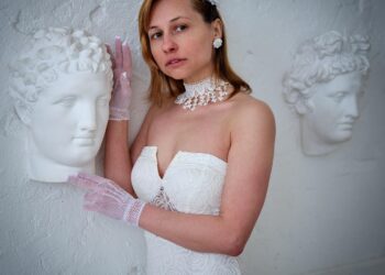 woman measuring bust for bralette