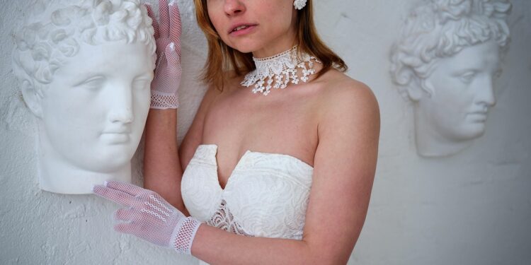 woman measuring bust for bralette