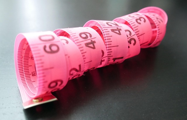 Woman measuring puff sleeve dress for fit