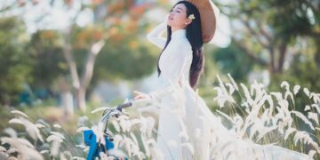 woman wearing colorful sunlight dress beach