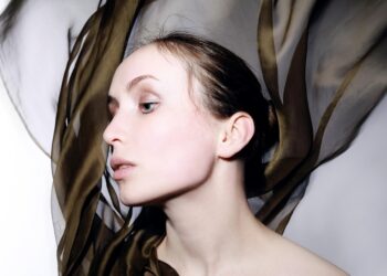 woman wearing a silk scarf top