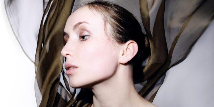woman wearing a silk scarf top