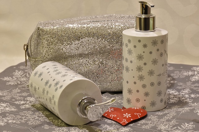 Skincare lotion bottles and a glitter cosmetic bag